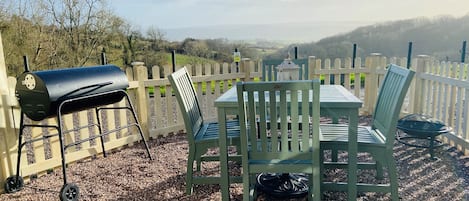 The private garden patio area with Bbq with amazing views over the valley below.