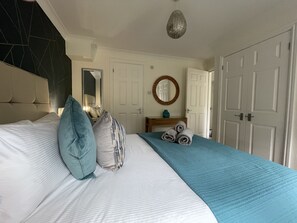 The master bedroom is beautifully decorated to a very high standard
