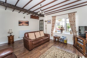 The cottage retains original features like the beamed ceiling which gives the place a real charm