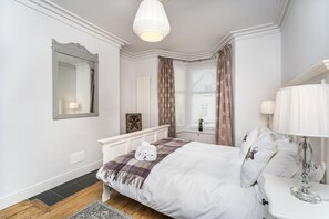 The room boasts a delightful Victorian bay window