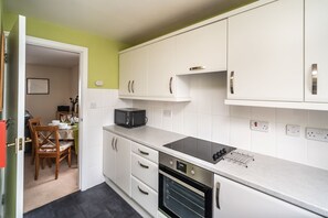 The kitchen is equipped with electric oven, ceramic hob, dishwasher, washer/dryer, microwave and toaster