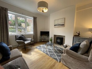 The living room features a smart TV so that you can enjoy your favourite shows in the evening