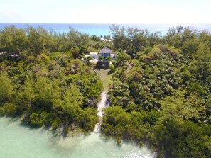 This lovely two-story home is located on exclusive gated Windermere Island.