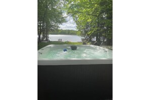 Hot tub with view of lake