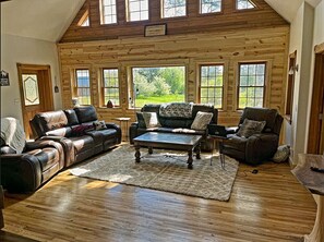 Living Room: Sun-soaked retreat with plush seating and stunning views, perfect for relaxation!