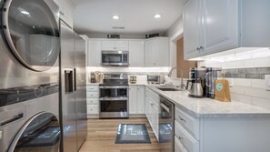 Modern and open kitchen with stainless steel appliances