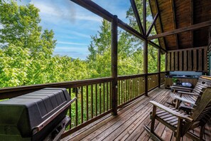 The NEST has private deck with grill, 4 rocking chairs and hot tub to start ~ end your day in relaxation mode.  