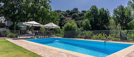 Fully-enclosed private pool, 10m x 5m with loungers, parasols, tables and chairs