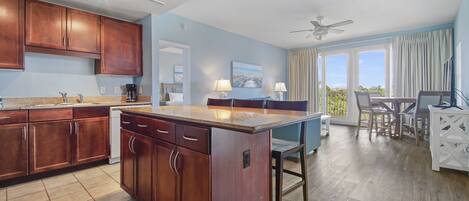 Fully Stocked Kitchen with Lake Views and Island Bar Seating