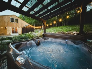 The covered 7 person hot tub helps you melt the stress away.