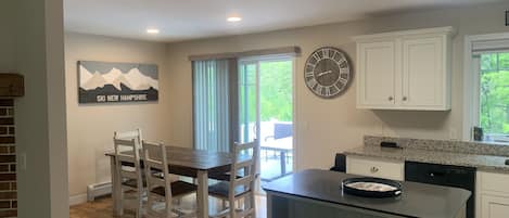 View from living room into kitchen and dining room