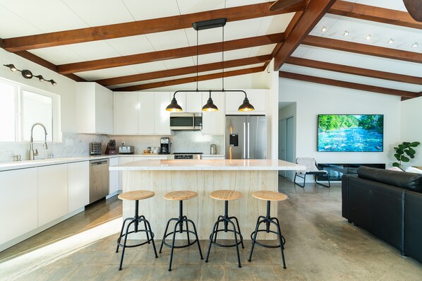 Kitchen with island has essentials to enjoy meal preparation