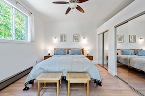 Bedroom 1 with king bed and sliding glass doors to patio.