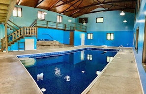 Indoor swimming poolroom with hot tub