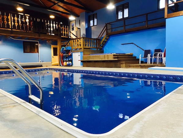 Indoor swimming poolroom with hot tub