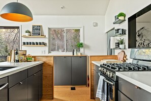 Fully equipped kitchen with a 4 burner stove, full size oven, dishwasher & more.