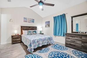 Master bedroom with a queen bed, smart TV and ceiling fan. On suite bathroom as well!