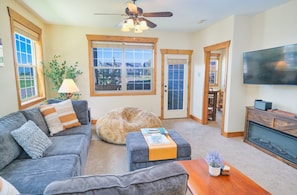 Kickback and relax in this comfortable living room after a day of play — be sure to make use of the smart TV to login to your streaming service of choice.