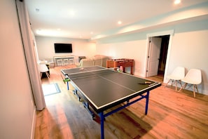 Lower level ping pong and foosball