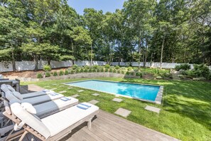 Back deck w/ 4 lounge chairs, dining table, BBQ grill & 2 retractable awnings