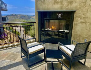 Ocean view deck with fireplace off master bedroom
