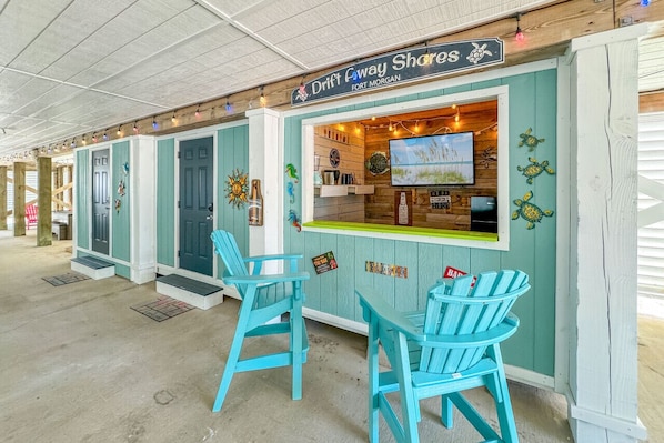 Hang out for hours of fun and relaxation by the covered Tiki Bar
