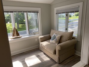 Sun Room seat pulls out to a twin sleeper for extra guests!