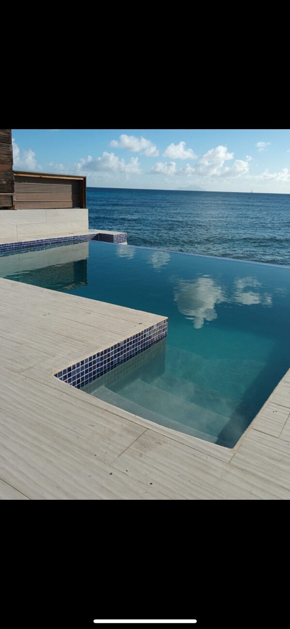 Caribbean Sunset. Directly on the beach. four bedroom five full baths