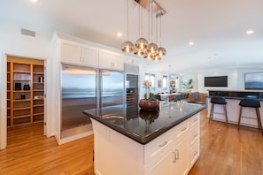 Walk in Pantry on left, large granite island with seating for 5