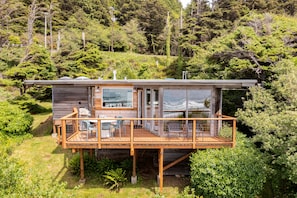 Perched on a hillside where the forest meets the sea.