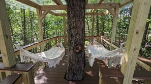 A surreal, serene place to be, hanging out in the forest canopy, in a treehouse