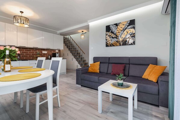 Living room with a comfortable sofa and TV. 