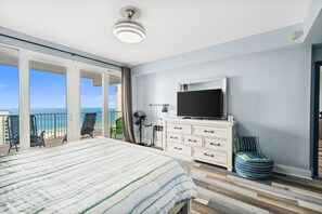 Primary Bedroom with Ocean Views, King Size Bed, Flat Screen TV, Ensuite Bathroom and Private Balcony Access