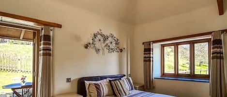 Spacious en-suite bedroom with king size bed and access to private garden 
