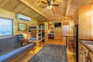 Living and Kitchen Area - Living area with 1 futon, 1 set of bunk beds, and a full kitchen