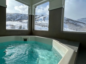 Interior common area hot tub overlooking Park City Mountain ski hill