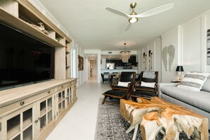 A look at the dining area and kitchen with walls lined in board and batten