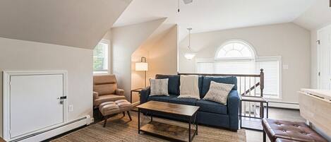 Living space with view of stairway entry