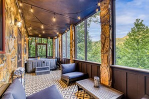 Hot Tub and Seating area in screened porch