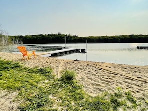 Enjoy the private sandy beach and lakefront.