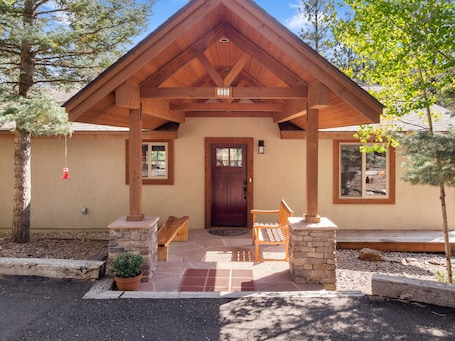 Welcome to our mountain retreat! Covered front porch with a bench on each side