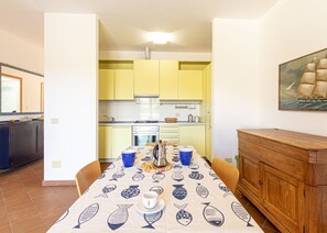 Table and Kitchen in the living room-Bellavista-Elba Island