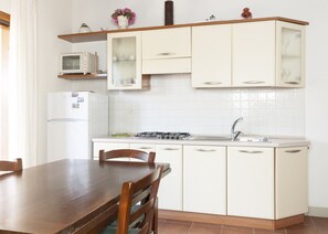 Perone, apartment in Elba Island, livingroom, kitchen corner