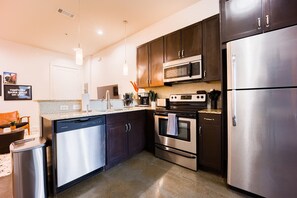 Fully equipped kitchen stocked with your basic cooking essentials and stainless-steel appliances.