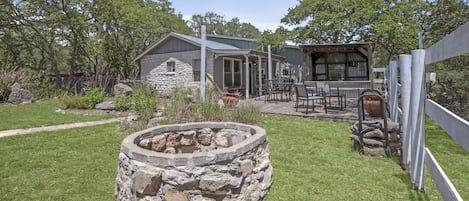 View of fire pit and front of home.