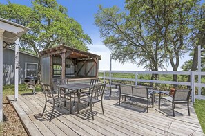 Outdoor dining space and covered bar area.