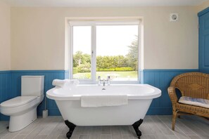 There are four beautiful bathrooms, some with garden views..