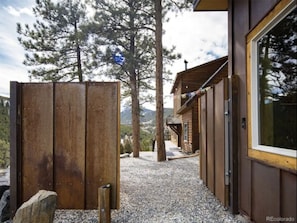 Gate entrance to home.  Window on right is sauna.