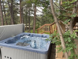 Relax in the pines while enjoying this beautiful hot tub.  This is the way to relax!