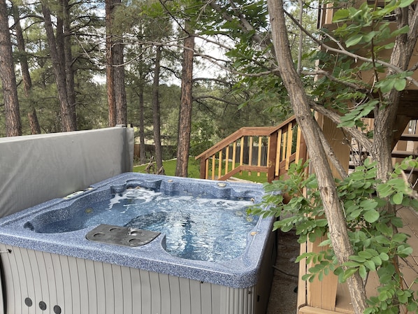 Relax in the pines while enjoying this beautiful hot tub.  This is the way to relax!